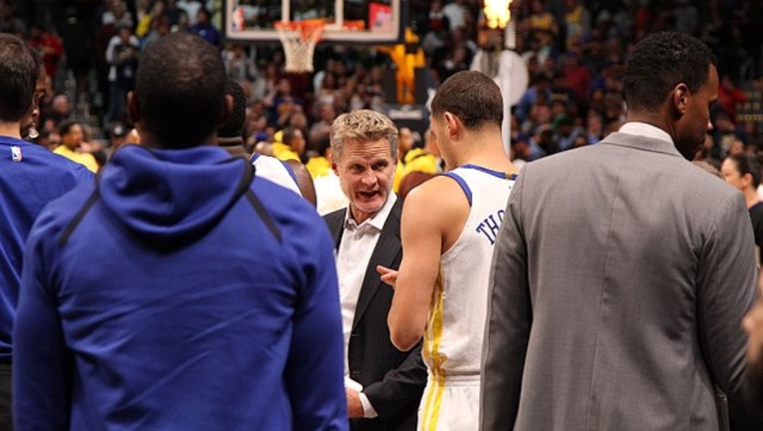 Steve Kerr talks to his team prior to the start of a game in Denver, Colorado.