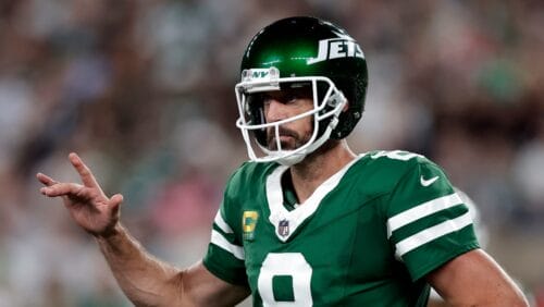 New York Jets quarterback Aaron Rodgers (8) reacts during an NFL football game against the New England Patriots Thursday, Sept. 19, 2024, in East Rutherford, N.J. (AP Photo/Adam Hunger)