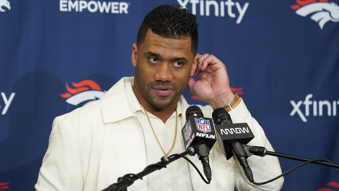 Denver Broncos quarterback Russell Wilson listens during a news conference after the team's NFL football game against the Los Angeles Chargers Sunday, Dec. 10, 2023, in Inglewood, Calif.