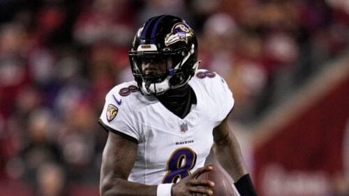 Baltimore Ravens quarterback Lamar Jackson looks for a receiver against the San Francisco 49ers during the first half of an NFL football game Monday, Dec. 25, 2023, in Santa Clara, Calif. (AP Photo/Godofredo A. Vásquez)