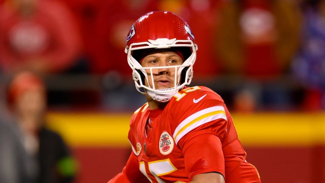 Kansas City Chiefs quarterback Patrick Mahomes looks to pass against the Buffalo Bills during the second half of an NFL football game, Sunday, Dec. 10, 2023 in Kansas City, Mo.