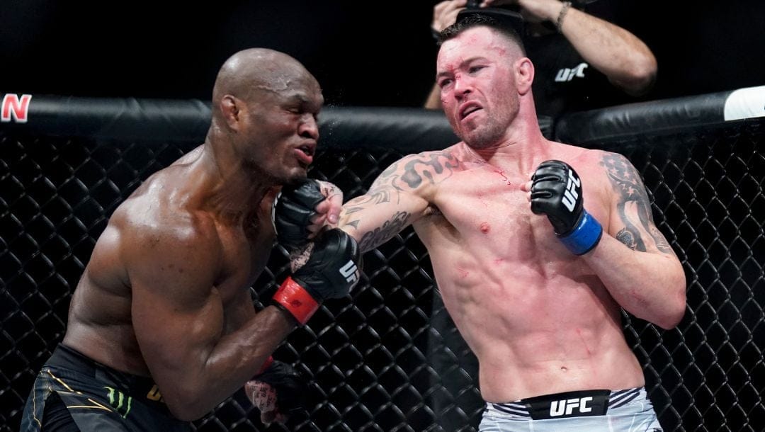 Colby Covington lands a punch against Kamaru Usman during a welterweight mixed martial arts championship bout at UFC 268.