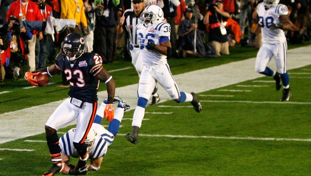 In this Feb. 4, 2007, file photo, Chicago Bears cornerback Devin Hester (23) scores on a 92-yard kickoff return against the Indianapolis Colts to open NFL football's Super Bowl XLI football game in Miami. The Colts won 29-17.
