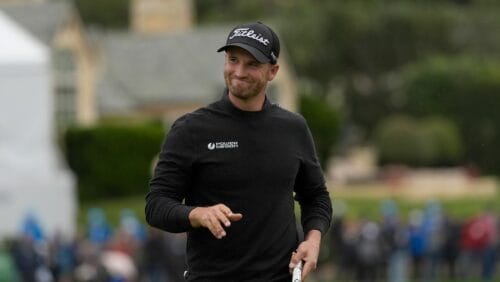 Wyndham Clark smiles while walking to the 18th green at Pebble Beach Golf Links during the third round of the AT&T Pebble Beach National Pro-Am golf tournament in Pebble Beach, Calif., Saturday, Feb. 3, 2024.