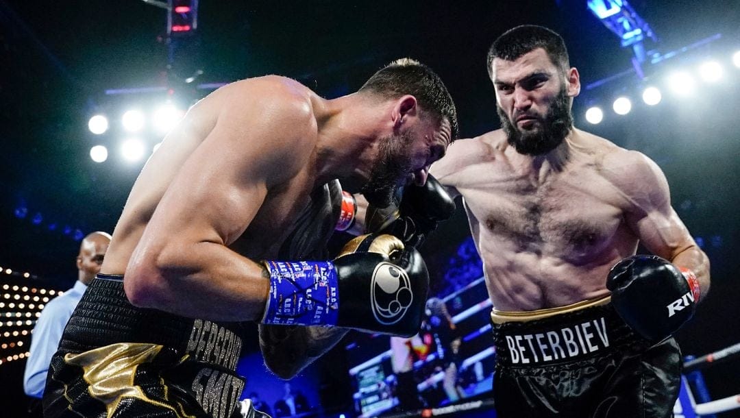 Artur Beterbiev, right, punches Joe Smith Jr. during the second round of a light heavyweight boxing bout Saturday, June 18, 2022.