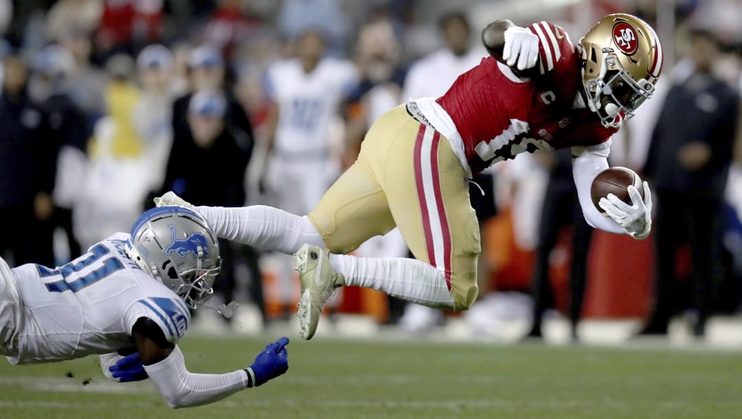 San Francisco 49ers wide receiver Deebo Samuel (19) evades Detroit Lions safety Kerby Joseph (31) in the second half during the NFC Championship NFL football game in Santa Clara, Calif., Sunday, Jan. 28, 2024.