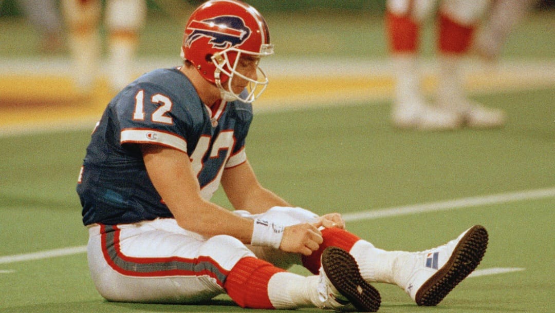 Dejected Buffalo Bills quarterback Jim Kelly hikes up his socks after being knocked down following his throwing an interception to Washington Redskins Kurt Gouveia in the third quarter of the Super Bowl XXVI Sunday, Jan. 26, 1992 in Minneapolis. The Redskins defeated the Bills 37-24.