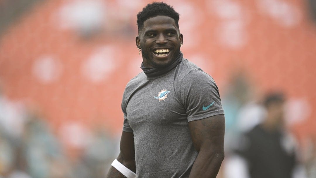 Miami Dolphins wide receiver Tyreek Hill (10) smiles during pre-game warm-ups before an NFL football game against the Washington Commanders, Sunday, Dec. 2, 2023, in Landover, Md.