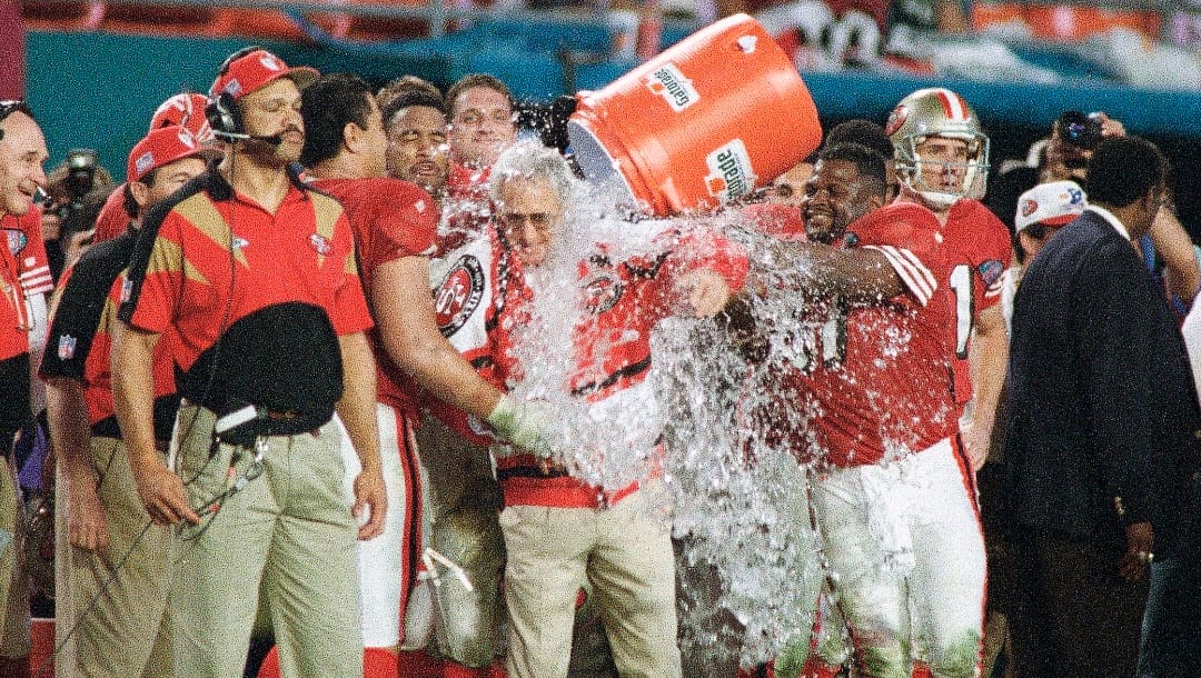San Francisco 49ers head coach George Seifert is doused by team members near the end of the fourth quarter of Super Bowl XXIX at Miami's Joe Robbie Stadium, Jan. 29, 1995. The 49ers defeated the San Diego Chargers, 49-26. (AP Photo/Lynne Sladky)