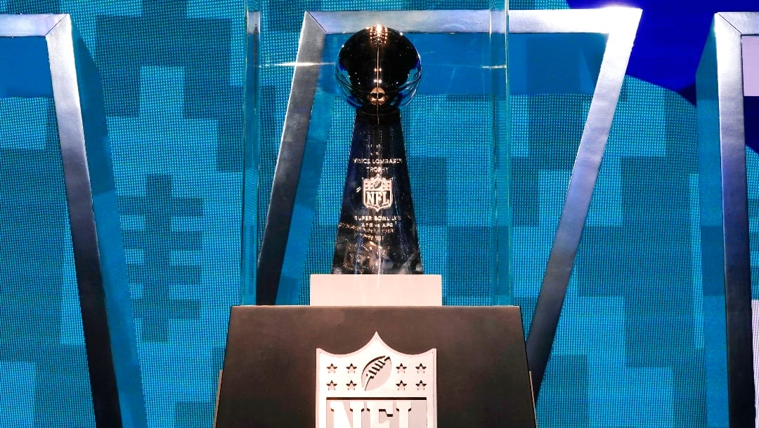 The Vince Lombardi Trophy stands on display at the Super Bowl Experience, open to fans for the first day, leading up to the NFL Super Bowl LVII football game in Phoenix, Saturday, Feb. 4, 2023. (AP Photo/Ross D. Franklin)