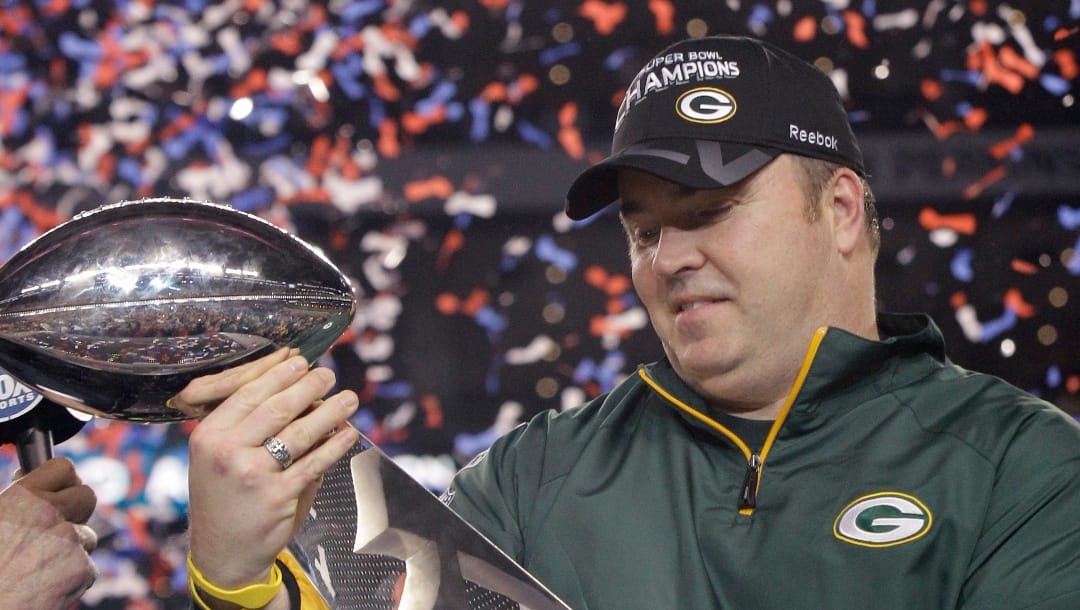 Green Bay Packers head coach Mike McCarthy holds the Vince Lombardi Trophy after beating the Pittsburgh Steelers 31-25 in the NFL Super Bowl XLV football game Sunday, Feb. 6, 2011, in Arlington, Texas. Everybody wants to know what's going through the mind of the man who led the Packers to a Super Bowl title before an unhappy ending with a midseason firing almost eight years later. (AP Photo/David J. Phillip, File)
