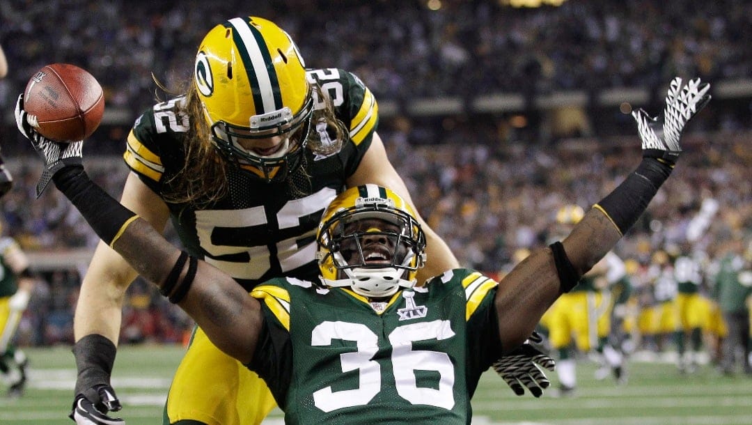 Green Bay Packers free safety Nick Collins (36) celebrates with teammate Clay Matthews after returning an interception for a touchdown during the first quarter of Super Bowl XLV against the Pittsburgh Steelers, Feb. 6, 2011, in Arlington, Texas. The Packers, with Aaron Rodgers as quarterback, led 21-10 at halftime and held off the Steelers in the second half to win 31-25 for their fourth Super Bowl championship.