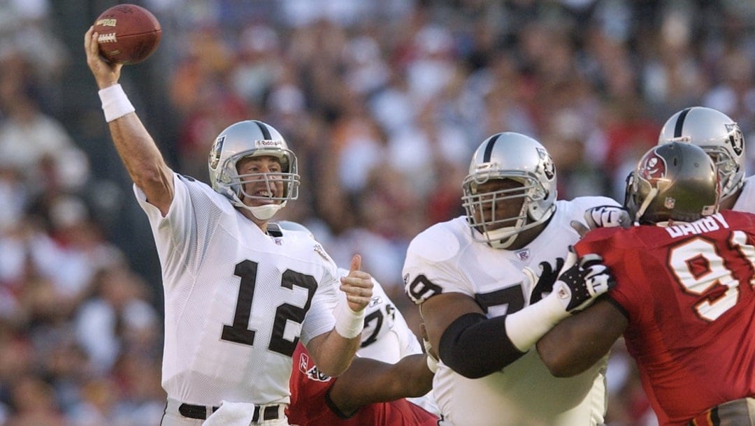 Oakland Raiders quarterback Rich Gannon (12) passes in the first quarter against the Tampa Bay Buccaneers in Super Bowl XXXVII in San Diego Sunday, Jan. 26, 2003.