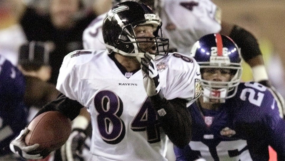 Baltimore Ravens wide receiver Jermaine Lewis (84) outruns New York Giants cornerback Emmanuel McDaniel (26) on his way to an 84-yard kick return for a touchdown during third-quarter action at Raymond James Stadium during Super Bowl XXXV in Tampa, Fla., Sunday, Jan. 28, 2001.
