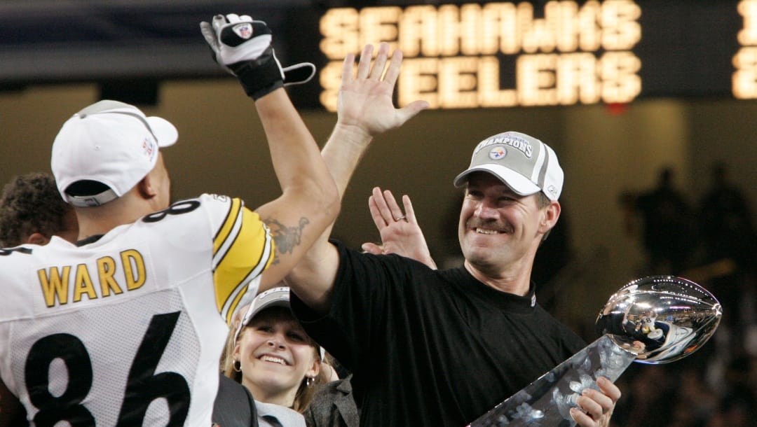 In this Sunday, Feb. 5, 2006 file photo, Pittsburgh Steelers head coach Bill Cowher high-fives Hines Ward (86), MVP of the Super Bowl XL football game, after they defeated the Seattle Seahawks, 21-10 in Detroit.