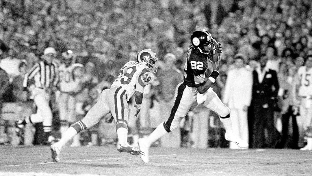 Pittsburgh Steelers receiver John Stallworth (82) makes a touchdown ahead of Los Angeles Rams defender Rod Perry (49) during the fourth quarter of Super Bowl XIV in Pasadena, Calif., Jan. 20, 1980. (AP Photo)