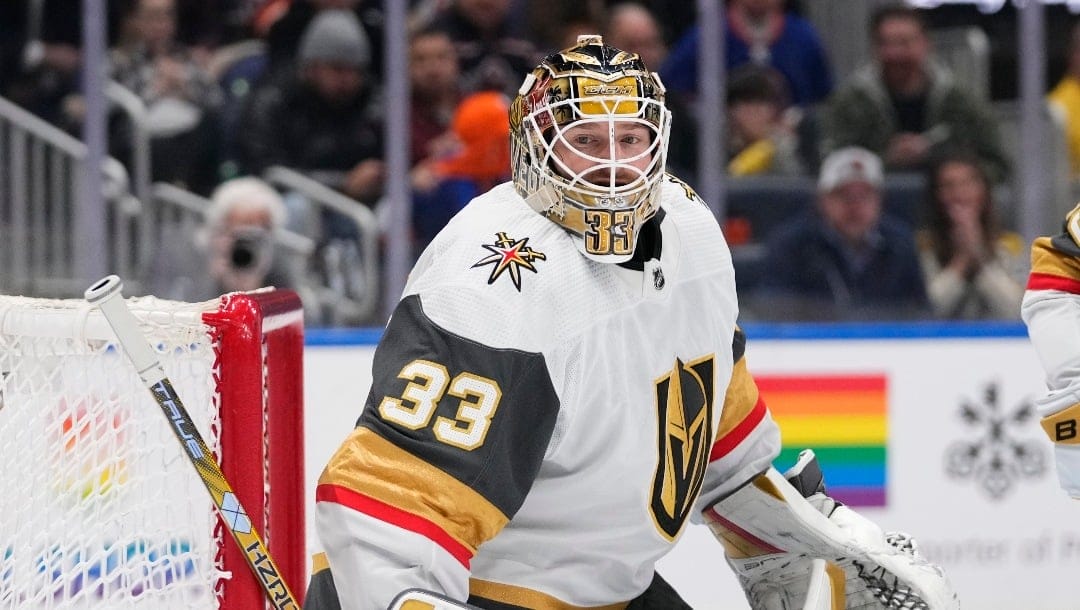Vegas Golden Knights goaltender Adin Hill (33) protects the net during the second period of an NHL hockey game against the New York Islanders Tuesday, Jan. 23, 2024, in Elmont, N.Y. (AP Photo/Frank Franklin II)