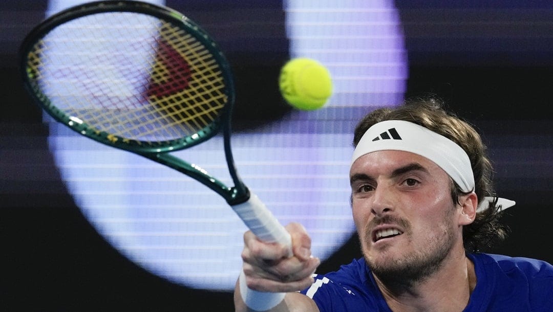 Stefanos Tsitsipas of Greece plays a forehand return to Germany's Alexander Zverev during their United Cup quarterfinal tennis match in Sydney, Australia, Friday, Jan. 5, 2024.
