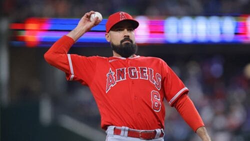 Los Angeles Angels third baseman Anthony Rendon throws the ball into the crowd in the first inning of a baseball game against the Texas Rangers, Tuesday, June 13, 2023, in Arlington, Texas.