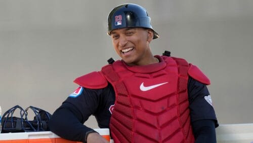 Cleveland Guardians catcher Bo Naylor sits near the bullpen during spring training baseball workouts in Goodyear, Ariz., Friday, Feb. 16, 2024.