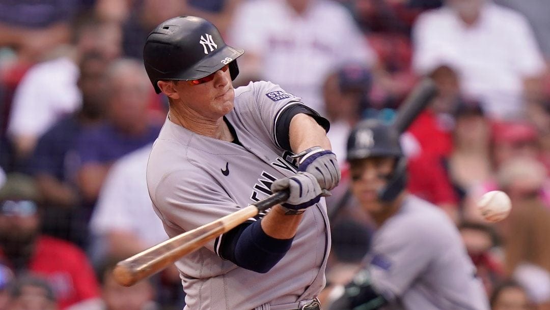 New York Yankees' DJ LeMahieu hits a one-run double in the sixth inning of the first game of a baseball doubleheader against the Boston Red Sox, Tuesday, Sept. 12, 2023, in Boston.