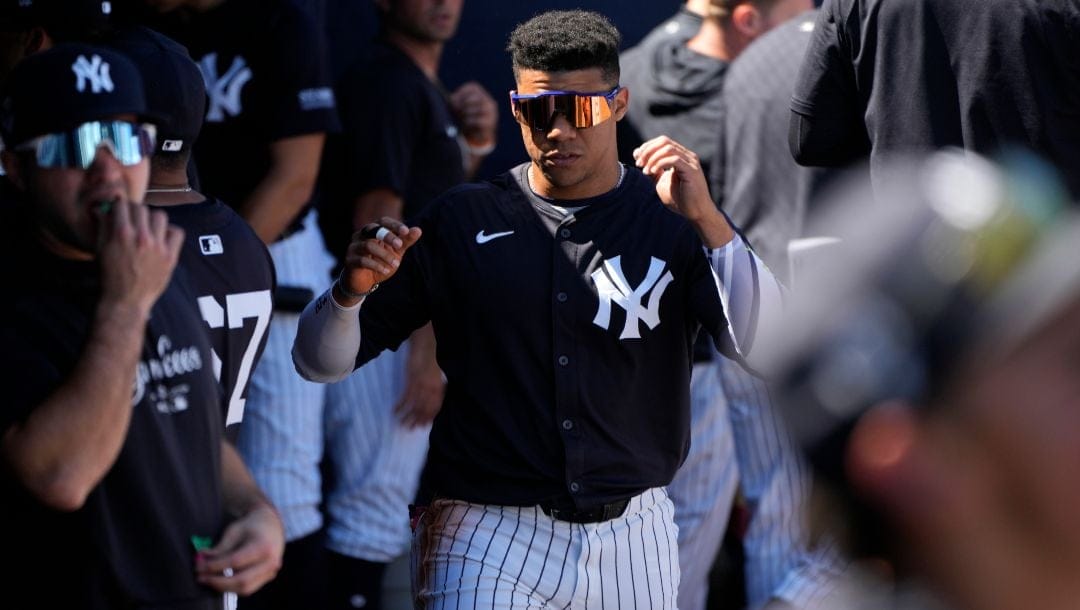 New York Yankees left fielder Juan Soto walks on the dugout during a spring training baseball game against the Minnesota Twins Monday, Feb. 26, 2024, in Tampa, Fla.