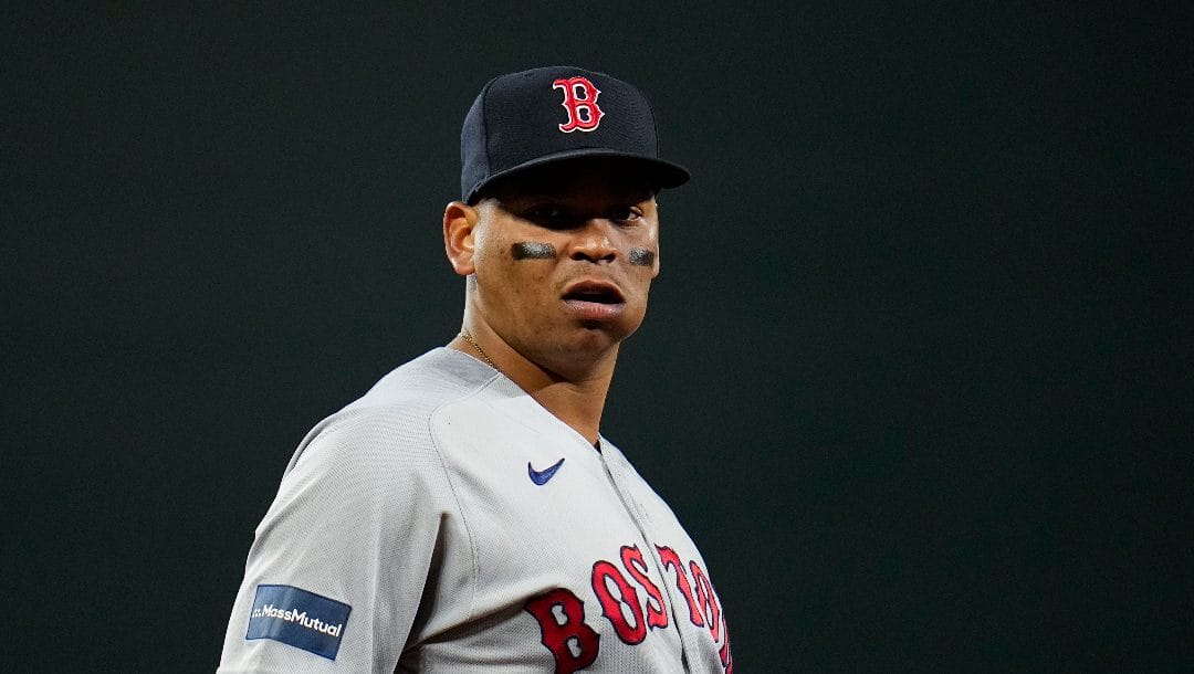 Boston Red Sox third baseman Rafael Devers looks on during the eighth inning of a baseball game against the Baltimore Orioles, Sept. 29, 2023, in Baltimore. With the Red Sox ramping up at the start of spring training, Devers made it clear Tuesday, Feb. 20, 2024, that he felt the franchise should have done more to improve the roster over the winter.