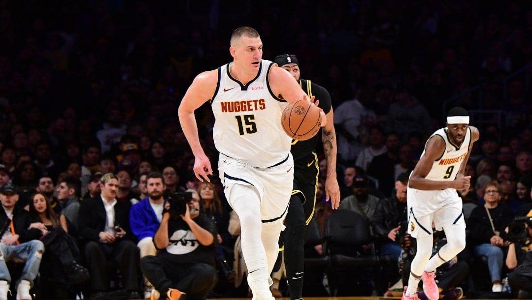 Nikola Jokic #15 of the Denver Nuggets dribbles the ball during the game against the Los Angeles Lakers on February 8, 2024 at Crypto.Com Arena in Los Angeles, California.