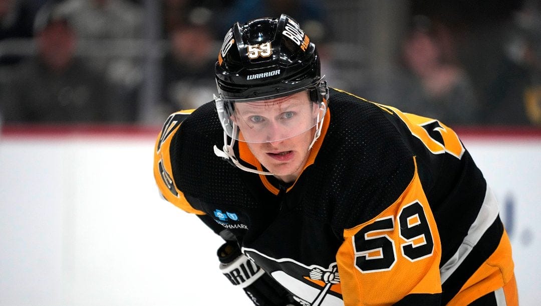Pittsburgh Penguins' Jake Guentzel prepares for a face-off during the second period of an NHL hockey game against the Florida Panthers in Pittsburgh, Friday, Jan. 26, 2024.