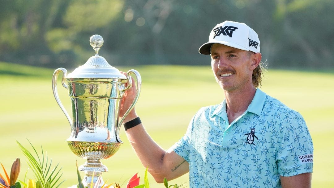 Jake Knapp, of the United States, poses with his trophy during the award ceremony after winning the Mexico Open golf tournament in Puerto Vallarta, Mexico, Sunday, Feb. 25, 2024.