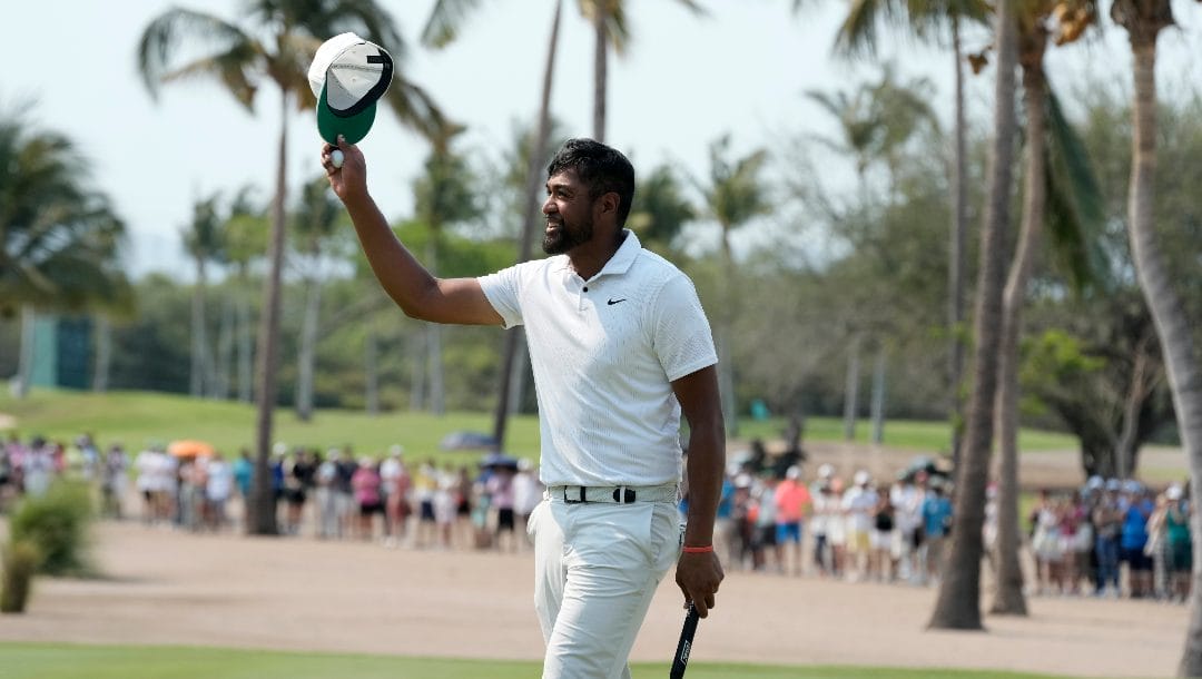 Tony Finau of the United States celebrates his victory in the Mexico Open golf tournament's final round in Puerto Vallarta, Mexico, Sunday, April 30, 2023.
