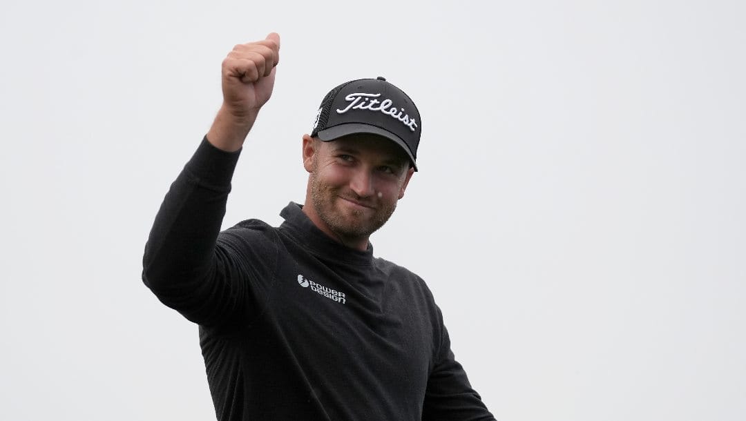 Wyndham Clark gestures after finishing the 18th hole at Pebble Beach Golf Links during the third round of the AT&T Pebble Beach National Pro-Am golf tournament in Pebble Beach, Calif., Saturday, Feb. 3, 2024.