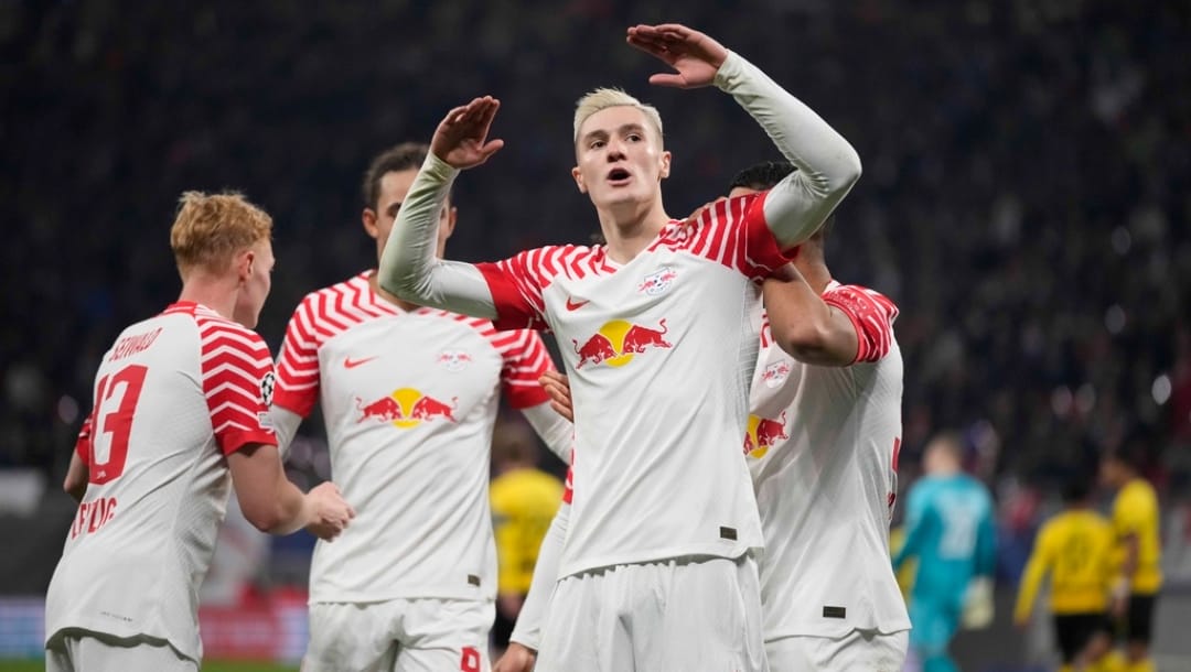 Leipzig's Benjamin Sesko celebrates after scoring his side's first goal during the group G Champions League soccer match between RB Leipzig and Young Boys Bern at the Red Bull arena stadium in Leipzig, Germany, Wednesday, Dec. 13, 2023.