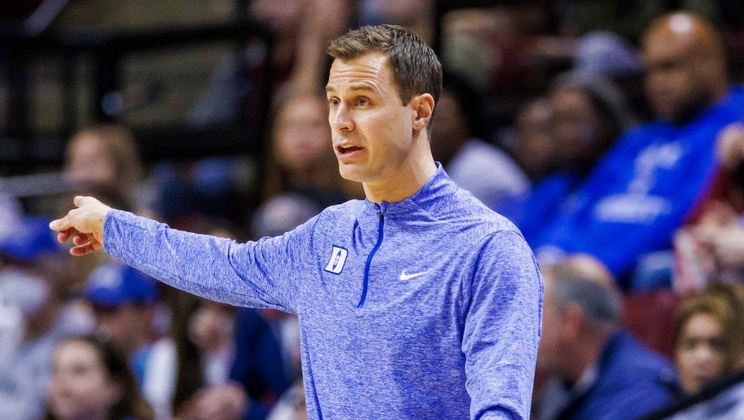Duke head coach Jon Scheyer directs his team during the first half of an NCAA college basketball game against Florida State, Saturday, Feb. 17, 2024, in Tallahassee, Fla. (AP Photo/Colin Hackley)