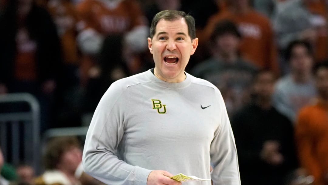 Baylor head coach Scott Drew calls out to his team during the second half of an NCAA college basketball game against Texas, Saturday, Jan. 20, 2024, in Austin, Texas. (AP Photo/Michael Thomas)