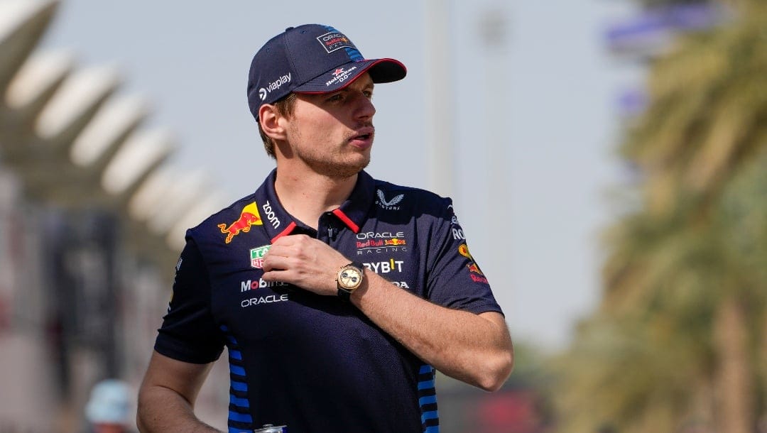 Red Bull driver Max Verstappen of the Netherlands walks through the paddock during Formula One pre season testings at the Bahrain International Circuit in Sakhir, Bahrain, Friday, Feb. 23, 2024. (AP Photo/Darko Bandic)