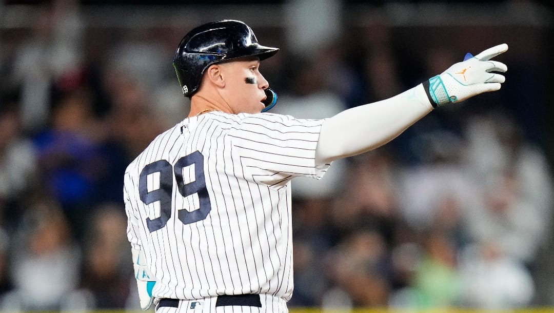 New York Yankees' Aaron Judge gestures to teammates after hitting a double during the first inning of a baseball game against the Arizona Diamondbacks Friday, Sept. 22, 2023, in New York. (AP Photo/Frank Franklin II)