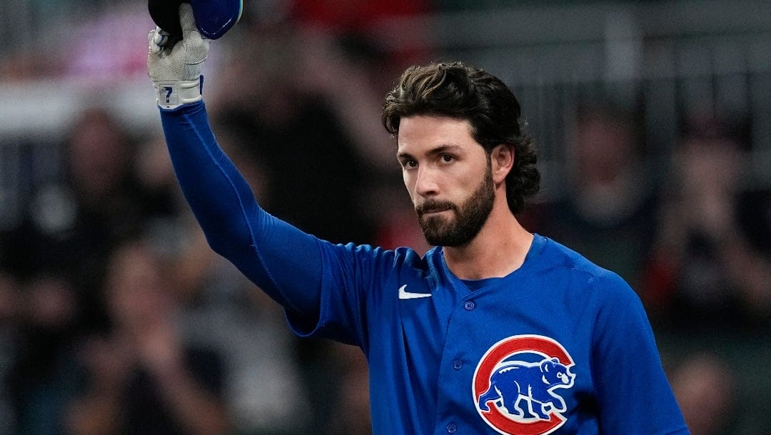Chicago Cubs' Dansby Swanson waves to the crowd before batting against his former team the Atlanta Braves in the second inning of a baseball game, Tuesday, Sept. 26, 2023, in Atlanta. (AP Photo/John Bazemore)