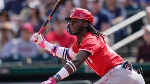 Cincinnati Reds' Elly De La Cruz watches his hit during the first inning of a spring training baseball game against the Cleveland Guardians, Saturday, Feb. 24, 2024, in Goodyear, Ariz.