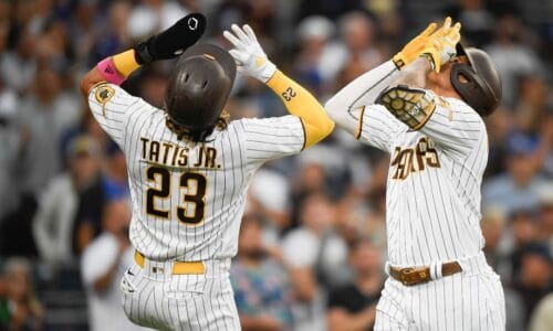 San Diego Padres' Manny Machado (13) celebrates with Fernando Tatis Jr. (23) after hitting a three-run home run during the first inning of a baseball game against the Los Angeles Dodgers, Monday, June 21, 2021, in San Diego.