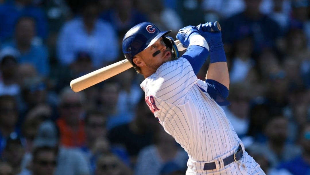 Chicago Cubs' Nico Hoerner watches his RBI sacrifice fly during the fifth inning of a baseball game against the Colorado Rockies Saturday, Sept. 23, 2023, in Chicago. Chicago won 6-3. (AP Photo/Paul Beaty)