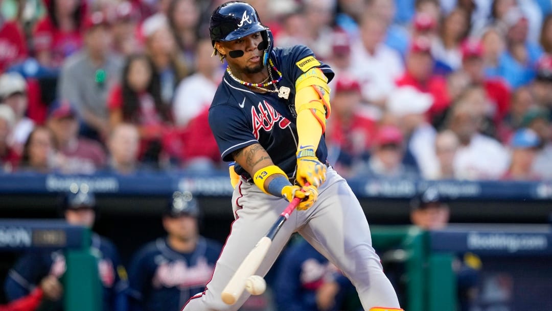 Atlanta Braves' Ronald Acuna Jr. hits a double during the third inning of Game 3 of a baseball NL Division Series against the Philadelphia Phillies in Philadelphia.