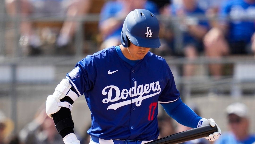 Los Angeles Dodgers designated hitter Shohei Ohtani prepares to bat during the third inning of a spring training baseball game against the Chicago White Sox in Phoenix, Tuesday, Feb. 27, 2024. (AP Photo/Ashley Landis)