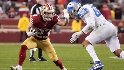 San Francisco 49ers running back Christian McCaffrey, left, fends off San Francisco 49ers defensive end Drake Jackson during the second half of the NFC Championship NFL football game in Santa Clara, Calif., Sunday, Jan. 28, 2024.