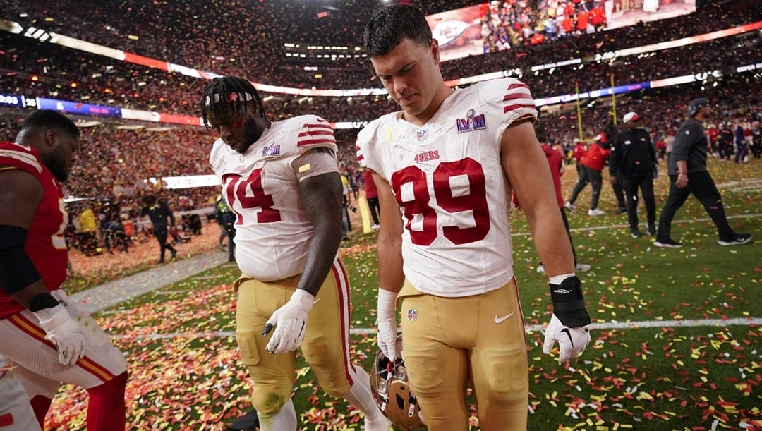 San Francisco 49ers offensive tackle Spencer Burford (74) and tight end Charlie Woerner (89) walk off the field after the NFL Super Bowl 58 football game against the Kansas City Chiefs Sunday, Feb. 11, 2024, in Las Vegas. The Chiefs won 25-22 against the 49ers.