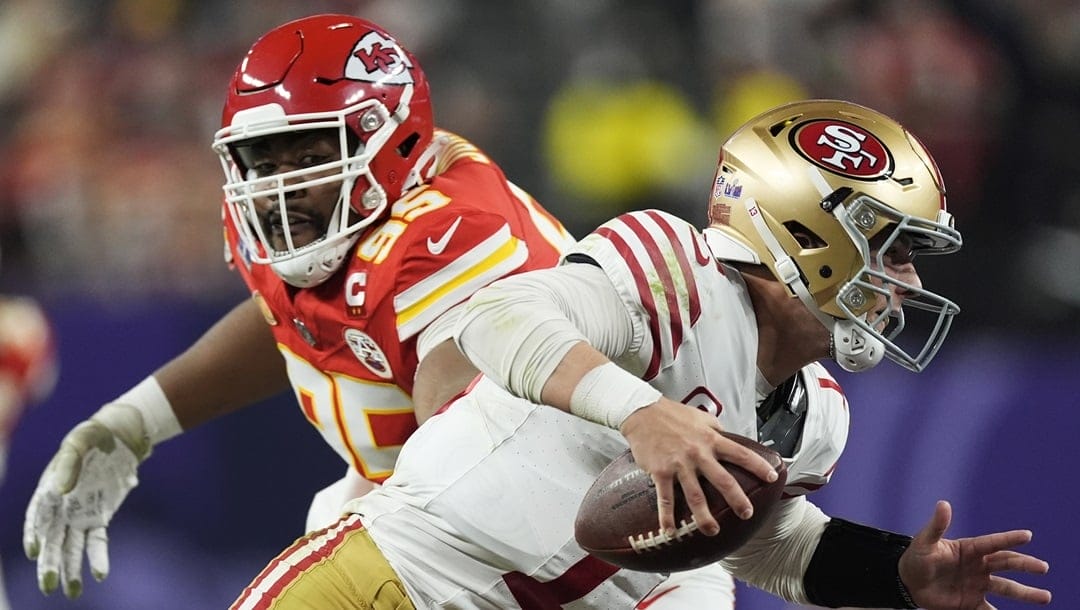 Kansas City Chiefs defensive tackle Chris Jones (95) chases San Francisco 49ers quarterback Brock Purdy (13) during the second half of the NFL Super Bowl 58 football game Sunday, Feb. 11, 2024, in Las Vegas.