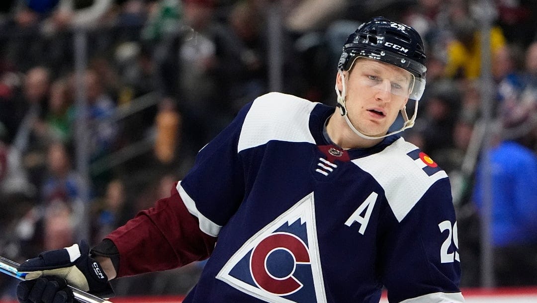 Colorado Avalanche center Nathan MacKinnon warms up before the second period of an NHL hockey game against the Dallas Stars Tuesday, Feb. 27, 2024, in Denver. (AP Photo/David Zalubowski)