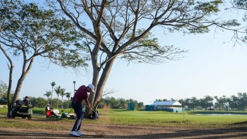 Troy Merritt, of the United States, hits from the sand on the first hole during the final round of the Mexico Open golf tournament in Puerto Vallarta, Mexico, Sunday, Feb. 25, 2024.