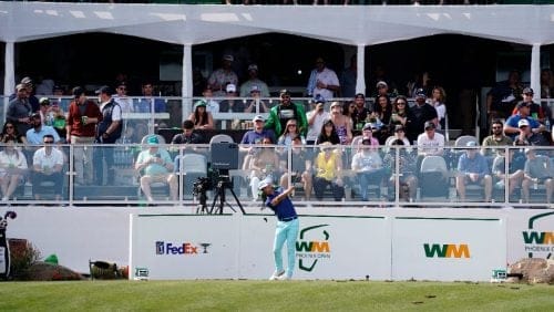 Taylor Moore watches his tee shot off on the 16th hole during the Phoenix Open golf tournament, Sunday, Feb. 12, 2023, in Scottsdale, Ariz.