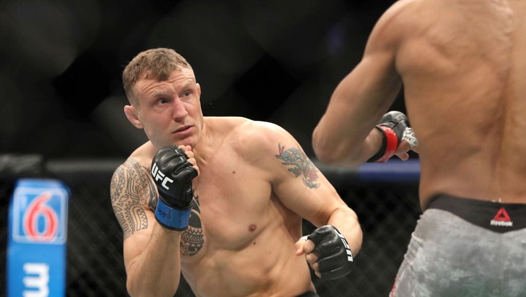 Jack Hermansson, left, in action against David Branch during their mixed martial arts bout at UFC Fight Night, Saturday.